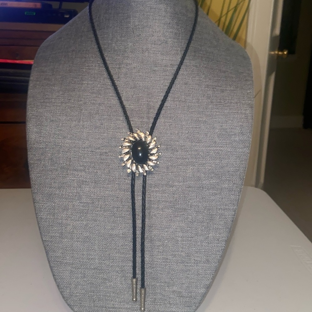 Vintage Oxidized Silver Flower with Black Stone on a Black Leather Bolo Tie